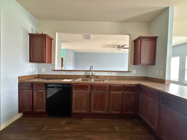 2709 Calypso Pl, Texas City, TX 77568 - kitchen featuring dishwasher, a sink, dark wood-style floors, and a peninsula