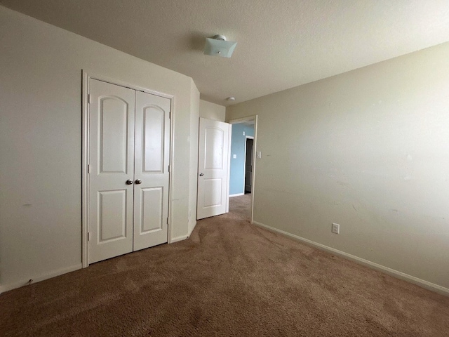 2709 Calypso Pl, Texas City, TX 77568 - unfurnished bedroom featuring carpet flooring, baseboards, and a closet
