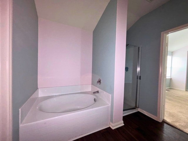 2709 Calypso Pl, Texas City, TX 77568 - bathroom featuring a garden tub, wood finished floors, a shower stall, baseboards, and lofted ceiling
