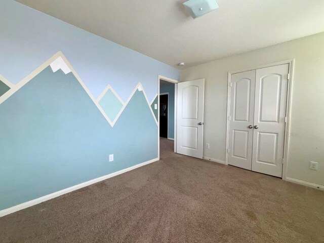 2709 Calypso Pl, Texas City, TX 77568 - unfurnished bedroom with carpet, baseboards, and a closet