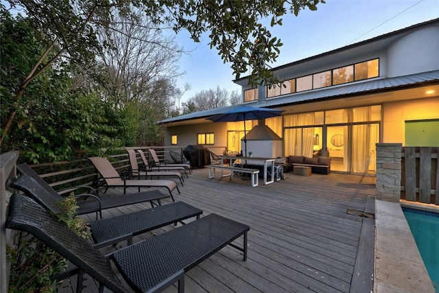 wooden deck featuring an outdoor living space