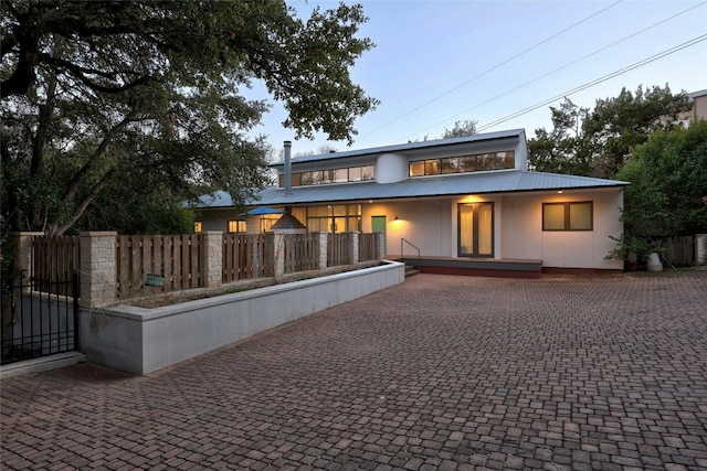 2909 Stratford Dr, Austin, TX 78746 - view of front facade featuring a metal roof and stucco siding