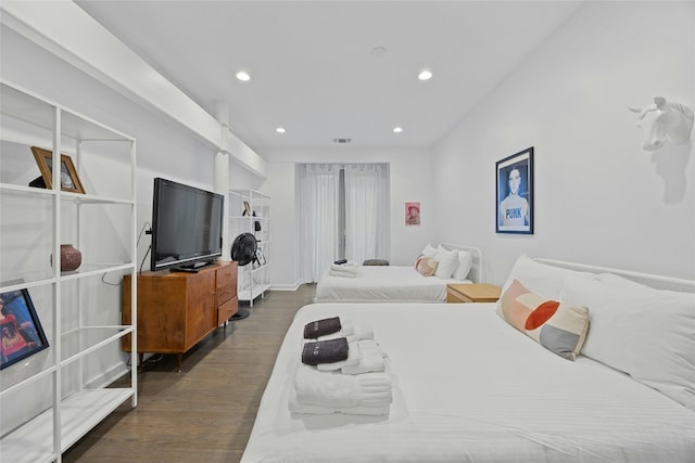 bedroom featuring dark hardwood / wood-style flooring