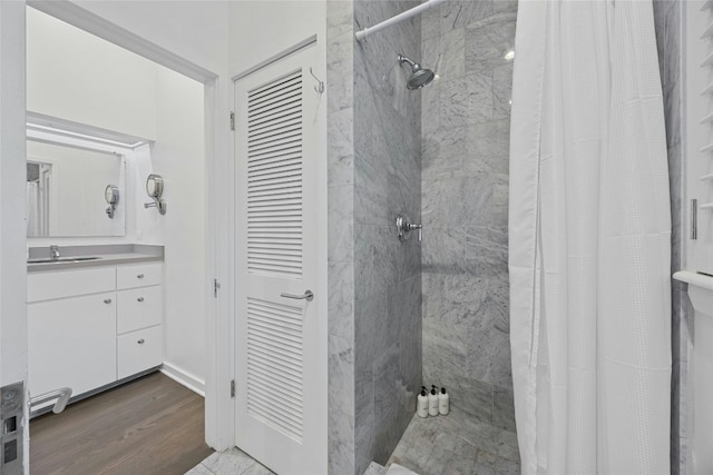 bathroom with vanity, wood-type flooring, and a shower with shower curtain