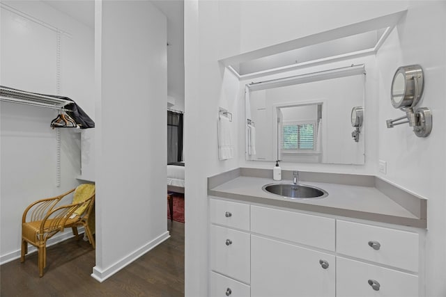 bathroom with hardwood / wood-style flooring and vanity