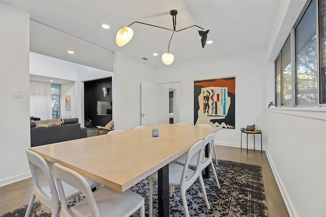 dining space with dark wood-type flooring