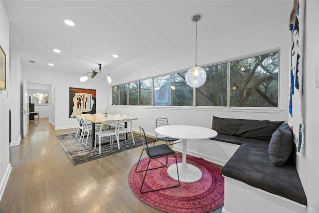 interior space with a wealth of natural light, hardwood / wood-style floors, and breakfast area