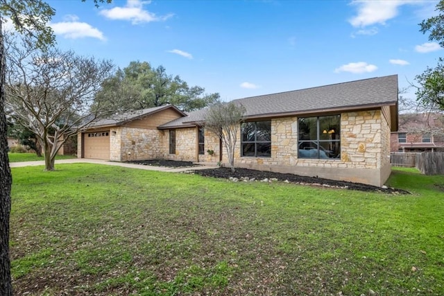 ranch-style home with a garage and a front yard