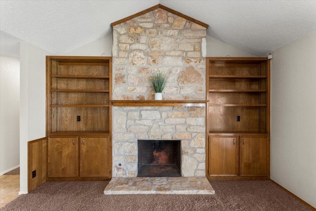 unfurnished living room featuring light carpet, a fireplace, a textured ceiling, and vaulted ceiling