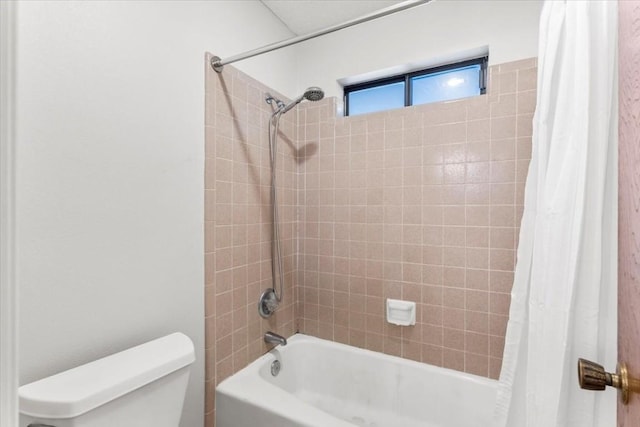 bathroom featuring toilet and shower / bath combo