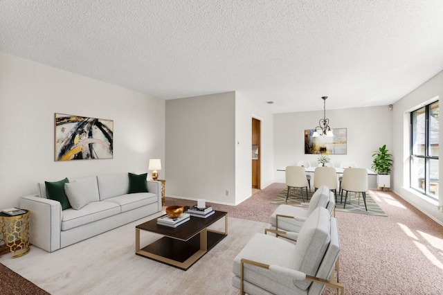 living room featuring light colored carpet and a textured ceiling