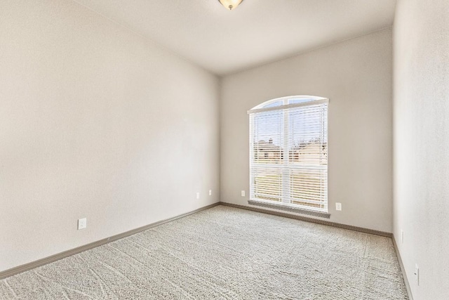 unfurnished room featuring carpet