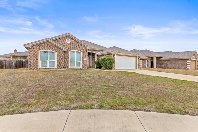 single story home with a garage and a front yard