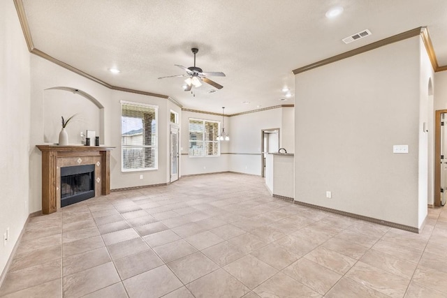 unfurnished living room featuring crown molding, ceiling fan, light tile patterned flooring, and a textured ceiling