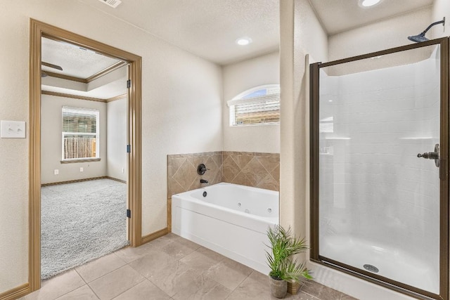 bathroom featuring tile patterned flooring, crown molding, a textured ceiling, and separate shower and tub