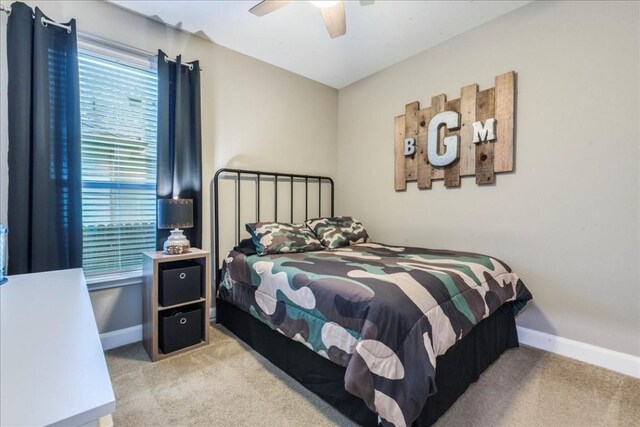 carpeted bedroom featuring ceiling fan