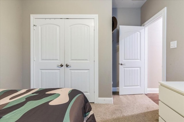 carpeted bedroom with a closet