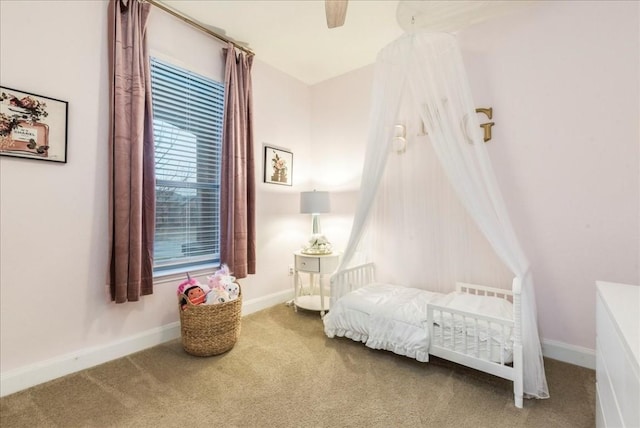 carpeted bedroom featuring ceiling fan