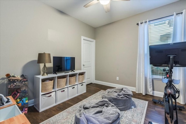 interior space featuring ceiling fan and dark hardwood / wood-style flooring