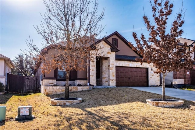 view of front of home with a garage and a front yard