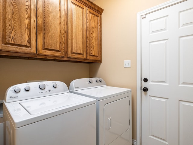 1504 County Road 459, Thorndale, TX 76577 - laundry room with washing machine and dryer and cabinet space
