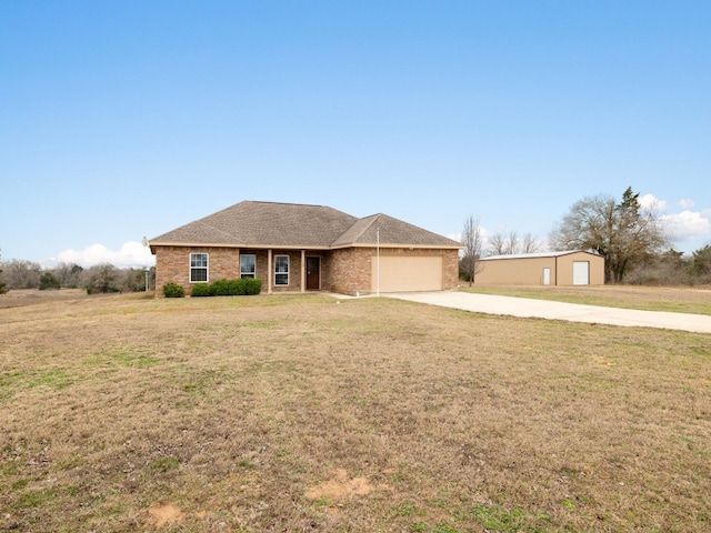 1504 County Road 459, Thorndale, TX 76577 - ranch-style home featuring driveway, an attached garage, and a front yard
