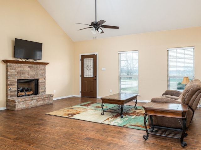 1504 County Road 459, Thorndale, TX 76577 - living area featuring ceiling fan, healthy amount of natural light, wood finished floors, a brick fireplace, and high vaulted ceiling