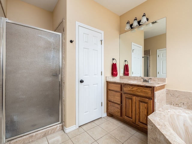 bathroom with tile patterned flooring, shower with separate bathtub, and vanity