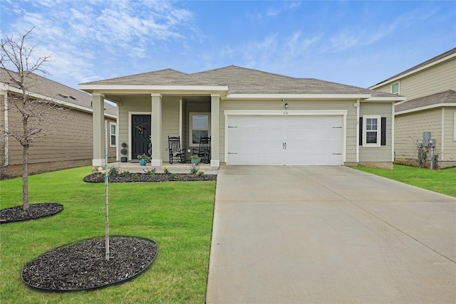 view of front of property with a garage, a front lawn, and a porch