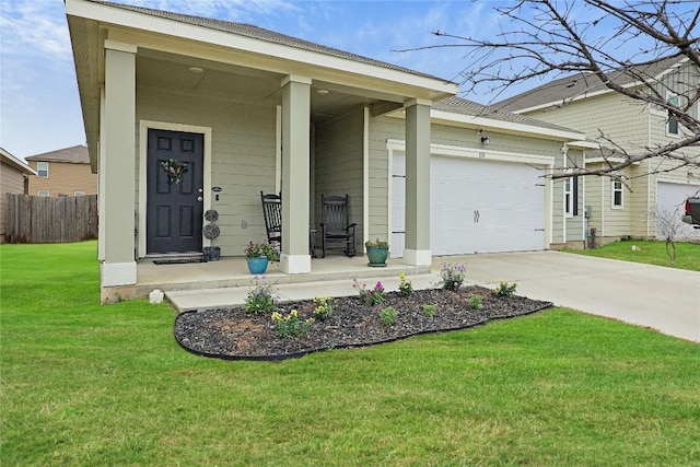 ranch-style house with a garage, a front yard, and covered porch