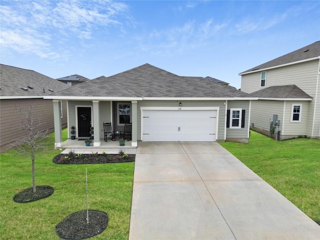 view of front of house featuring a garage, a front lawn, and a porch