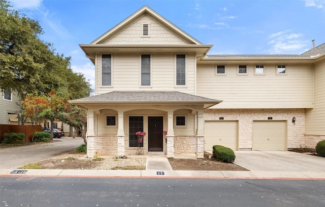 view of front of house with a porch and a garage