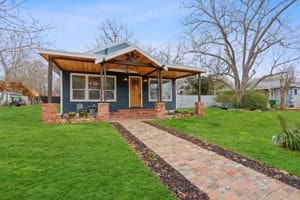 view of front of home with a front lawn and a porch