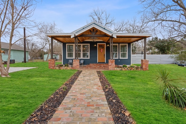 view of front of property with a porch and a front lawn