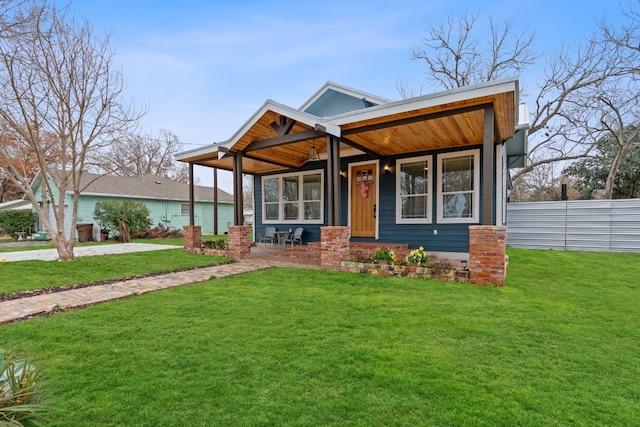 view of front of property featuring a front yard and a porch