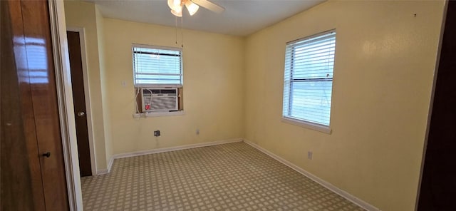 spare room with cooling unit, ceiling fan, and light carpet