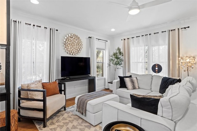 living room with ornamental molding, wood finished floors, a ceiling fan, and recessed lighting