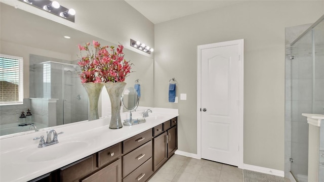 bathroom featuring independent shower and bath, vanity, and tile patterned flooring