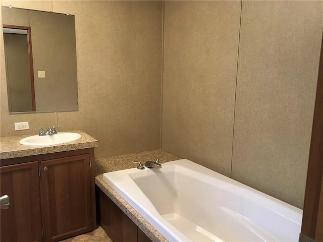 bathroom with vanity and a bathing tub