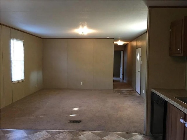 interior space featuring ornamental molding and light carpet