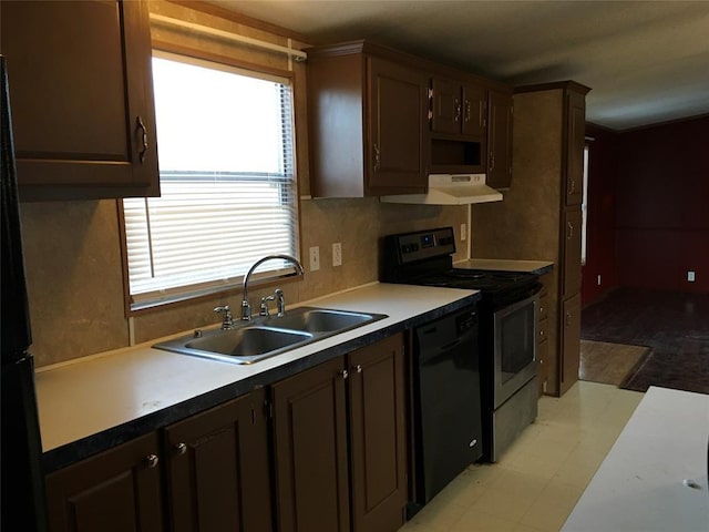 kitchen featuring sink, dark brown cabinets, and black appliances