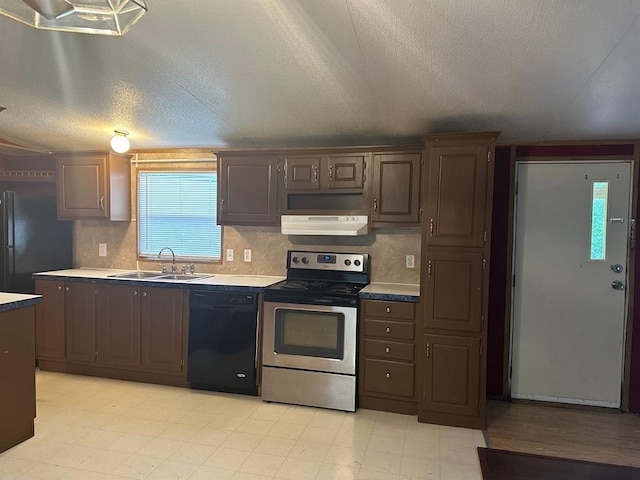 kitchen featuring sink, a textured ceiling, dark brown cabinets, decorative backsplash, and black appliances