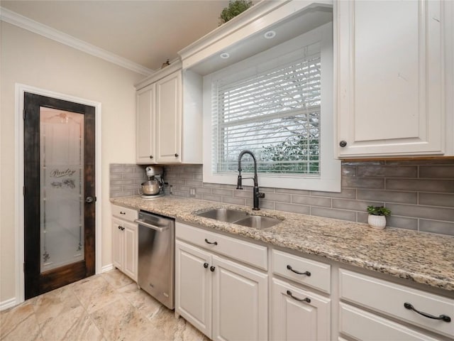 112 Chaumont St, Kingsland, TX 78639 - kitchen featuring dishwasher, light stone counters, a sink, crown molding, and tasteful backsplash