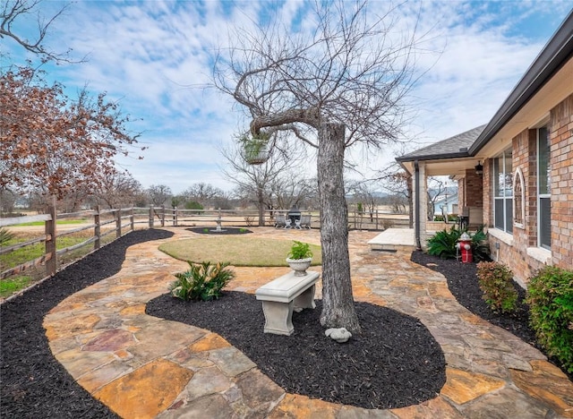 112 Chaumont St, Kingsland, TX 78639 - fenced backyard with a patio area