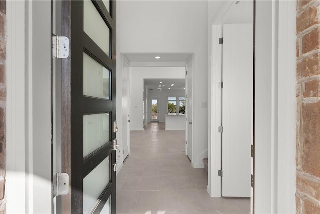 corridor featuring baseboards and recessed lighting