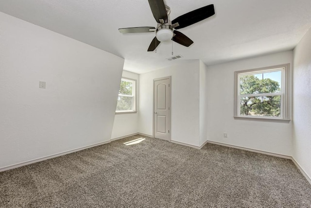 carpeted empty room with ceiling fan