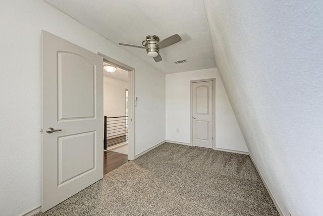 unfurnished bedroom with ceiling fan and carpet floors