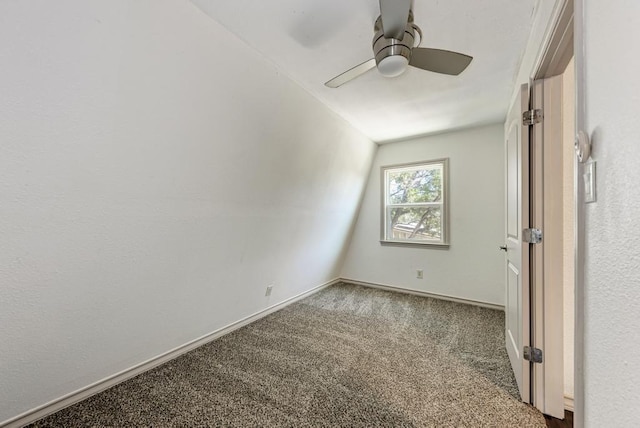 carpeted empty room with lofted ceiling and ceiling fan