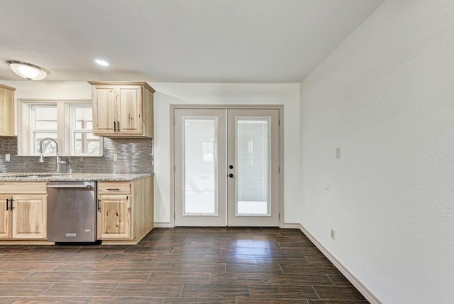 kitchen featuring sink, dishwasher, backsplash, light brown cabinetry, and french doors