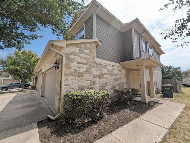 view of property exterior with a garage